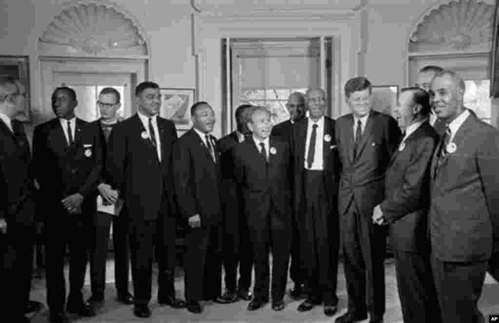 In this Aug. 28, 1963 file photo, President Kennedy poses at the White House with a group of leaders of the March on Washington. From left, Whitney Young, National Urban League; Dr. Martin Luther King, Christian Leadership Conference; John Lewis, Student