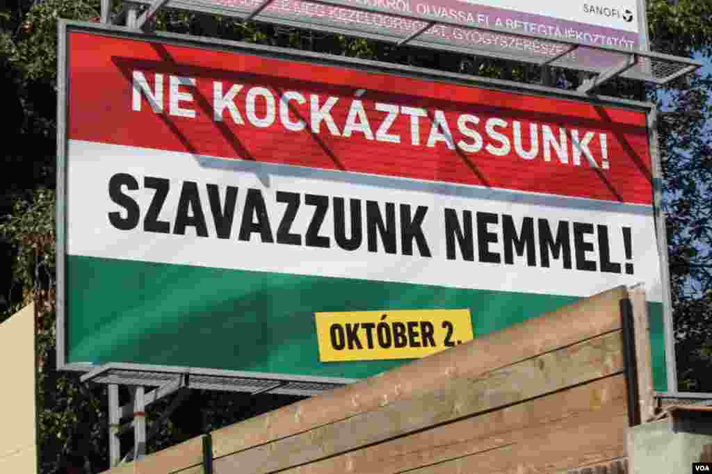 Two days before Hungary votes on whether it will reject European Union mandated refugee minimums, this poster urges people to vote “no,” Sept. 30, 2016. (VOA/H. Murdock) 