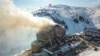 This handout photograph released by the Demiroren News Agency (DHA) on January 21, 2025, shows an aerial picture of a fire on the fourth floor of the 11-storey hotel in Bolu's Kartalkaya ski resort.