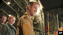 Three Dutch marines who were captured after a botched evacuation mission in Libya last month arrive at Athens' airport, March 11, 2011