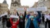 FILE - Demonstrators rally, calling for the resignation of Czech Prime Minister Andrej Babis, in Prague, Czech Republic, June 9, 2020.