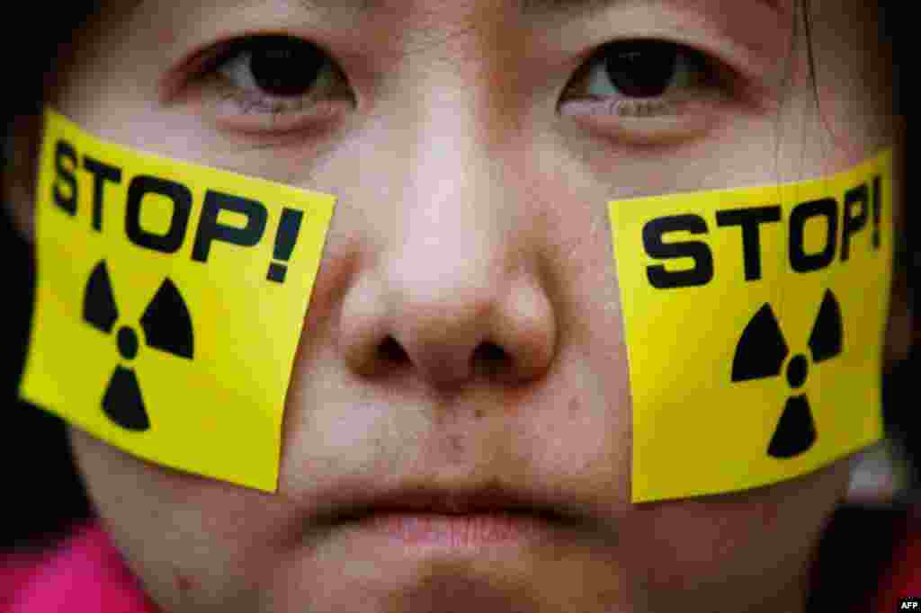 April 15: An anti-nuclear protester takes part in a rally in front of Tokyo Electric Power Co (TEPCO)'s headquarters in Tokyo. (Reuters/Yuriko Nakao)