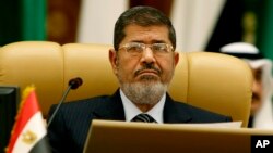Egyptian President Mohamed Morsi attends the third session of the Arab Economic Summit in Riyadh, Saudi Arabia, Jan. 21, 2013. 