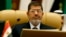 Egyptian President Mohamed Morsi attends the third session of the Arab Economic Summit, in Riyadh, Saudi Arabia, Jan. 21, 2013. 