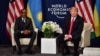 US President Donald Trump (R) and Rwandan President President Paul Kagame attend a bilateral meeting on the sideline of the annual meeting of the World Economic Forum (WEF) on January 26, 2018 in Davos, eastern Switzerland. / AFP PHOTO / Nicholas Kamm