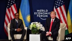 US President Donald Trump (R) and Rwandan President President Paul Kagame attend a bilateral meeting on the sideline of the annual meeting of the World Economic Forum (WEF) on January 26, 2018 in Davos, eastern Switzerland. / AFP PHOTO / Nicholas Kamm