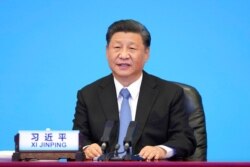 FILE - Chinese President Xi Jinping delivers a speech in Beijing, July 6, 2021, in this photo released by Xinhua News Agency.