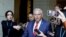 FILE - U.S. Senator Robert Menendez is trailed by reporters after departing the Senate Democratic Caucus in Washington, Sept. 28, 2023. 