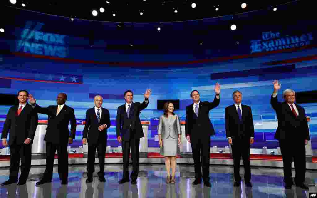 August 11: U.S. Republican presidential candidates gather before the start of their debate in Ames, Iowa. From L to R: Rick Santorum, Herman Cain, Ron Paul, Mitt Romney, Michele Bachmann, Tim Pawlenty, Jon Huntsman and Newt Gingrich. REUTERS/Jim Young