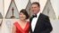 FILE - Accountants Martha Ruiz and Brian Cullinan from PricewaterhouseCoopers are pictured at the Oscars in Los Angeles, Feb. 26, 2017.