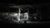 An Israeli police officer inspects the scene of one of a series of bus explosions in what authorities said appeared to be a militant attack in Bat Yam, central Israel, Feb. 20, 2025.