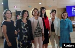 FILE - Germany's Foreign Minister Annalena Baerbock, Belgium's Foreign Minister Hadja Lahbib, Slovenia's Foreign Minister Tanja Fajon, Bulgaria's Foreign Minister Mariya Gabriel, France's Foreign Minister and European Affairs Minister Catherine Colonna and Romania's Foreign Minister Luminita Odobescu pose for a photo during an informal meeting of EU foreign ministers in Toledo, Spain, August 31, 2023.