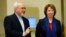 EU foreign policy chief Catherine Ashton (R) arrives with Iranian Foreign Minister Mohammad Javad Zarif before the start of three days of closed-door nuclear talks at the U.N. European headquarters in Geneva, Nov. 20, 2013