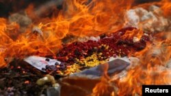 Confiscated drugs burned during a ceremony to mark the International Day against Drug Abuse and Illicit Trafficking, in Phnom Penh, Cambodia, June 26, 2018. REUTERS/Samrang Pring