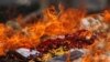 FILE - Confiscated drugs burned during a ceremony to mark the International Day against Drug Abuse and Illicit Trafficking, in Phnom Penh, Cambodia, June 26, 2018. REUTERS/Samrang Pring