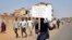A demonstrator holds a placard during a rally protesting the United States' unilateral arms embargo on the country, in Juba, South Sudan, Feb. 6, 2018. 
