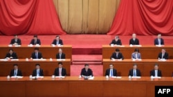 China's President Xi Jinping (C) speaks at a ceremony marking the centennial of the May Fourth Movement, a landmark student protest against colonialism and imperialism, in Beijing's Great Hall of the People, April 30, 2019.