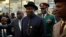 Nigeria's President Goodluck Jonathan arrives for service for former South African President Nelson Mandela, First National Bank Stadium, Johannesburg, Dec. 10, 2013.