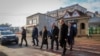 FILE - Moldovan President Maia Sandu crosses a road during a visit to areas affected by gas and electricity shortages, in Varnita, Moldova, on Jan. 9, 2025. Sandu traveled to Ukraine on Jan. 25, 2025, to discuss energy, among other issues.