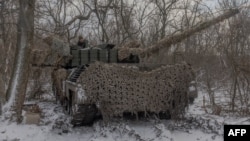 Український танкіст 68-ї бригади на танку Leopard 1A5 поблизу Покровська, Донеччина, 13 грудня 2024 р. Roman PILIPEY/AFP