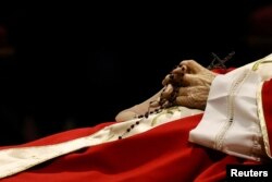 The body of former Pope Benedict lies in St. Peter's Basilica at the Vatican, January 2, 2023. (REUTERS/Kai Pfaffenbach)