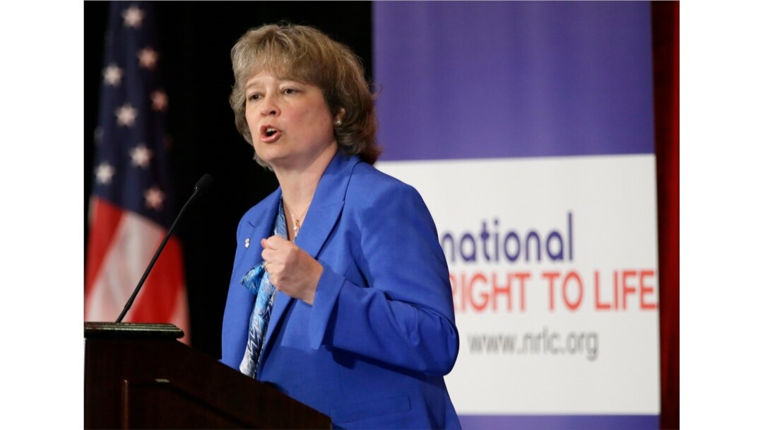FILE - Carol Tobias, president of National Right to Life, speaks at the national convention before introducing featured speaker Gov. Rick Perry, June 27, 2013, in Grapevine, Texas.