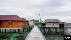 This photo taken on July 3, 2024 shows a general view of stilt houses at the village of the Bajau sea nomads in Pulau Papan in Sulawesi.