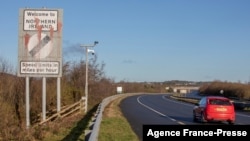 FILE - Signage welcoming motorists from the Irish Republic into Northern Ireland is pictured on the main Dublin/Belfast motorway near Newry, Jan. 1, 2021, at the beginning of Britain's life outside the European Union.