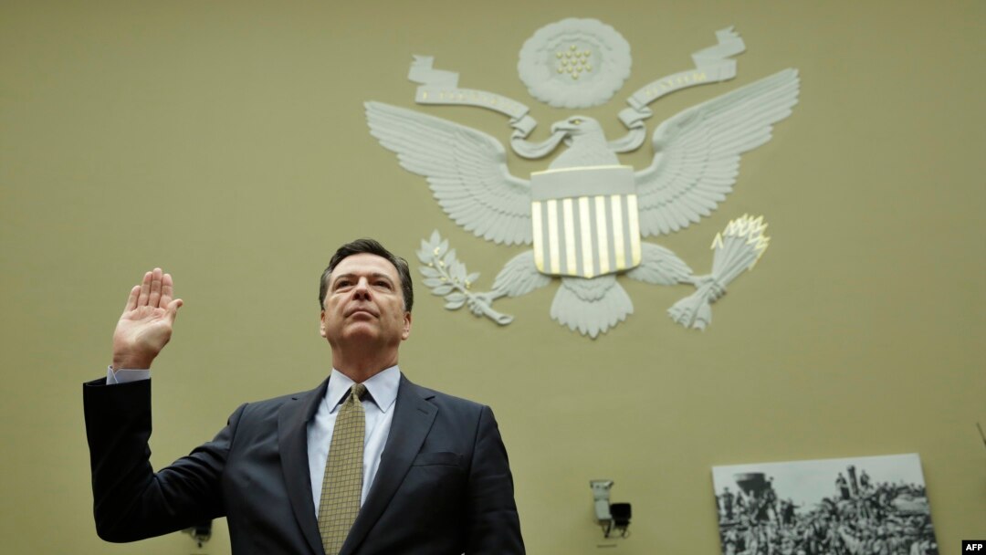FILE - FBI Director James Comey is swornin before a House Oversight and Government Reform Committee hearing on Capitol Hill in Washington, D.C., July 7, 2016. Comey is scheduled to testify Thursday at a highly anticipated hearing on possible connections between President Donald Trump's campaign and Russia.