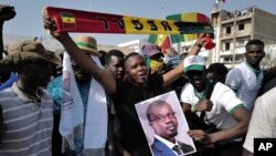 FILE - Supporters of Senegal opposition leader Ousmane Sonko take to the streets of Dakar, Tuesday March 14, 2023.