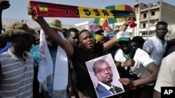 FILE - Supporters of Senegal opposition leader Ousmane Sonko take to the streets of Dakar, Tuesday March 14, 2023. 