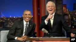 President Barack Obama with host David Letterman take a break during a taping of CBS's The Late Show with David Letterman at the Ed Sullivan Theater in New York, May 4, 2015. 