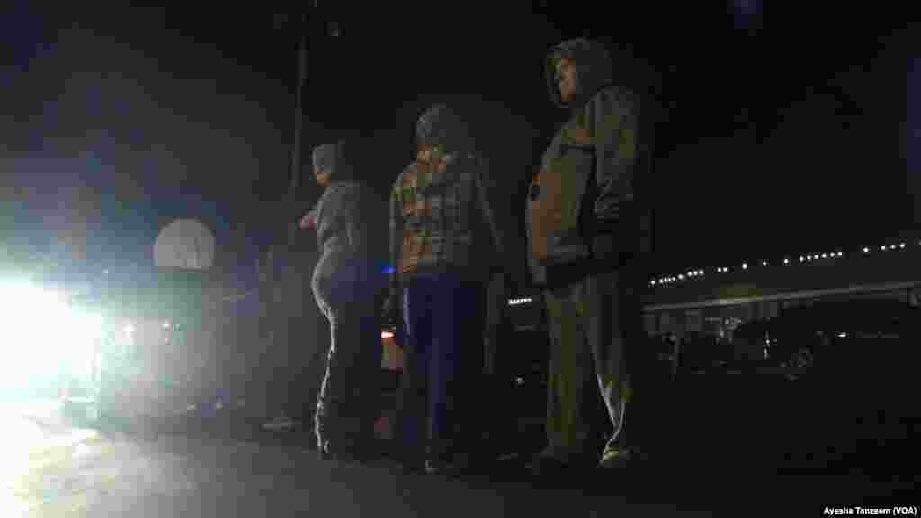 Protesters gather outside the Ferguson Police Department, in Ferguson, Missouri, Nov. 25, 2014.