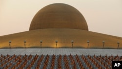 Thai Buddhist monks pray and gather at Wat Dhammakaya temple in Pathum Thani, Thailand, Feb. 22, 2016.