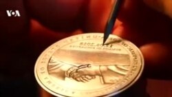 Золотой медальон о встрече Трампа и Ким Чен Ына