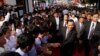 Cambodian Prime Minister and President of Cambodian People's Party Hun Sen, second right in front, greets his supporters after an event by his ruling party to mark the 37th anniversary of the 1979 downfall of the Khmer Rouge regime at the party headquarters in Phnom Penh, Cambodia, Thursday, Jan. 7, 2016. (AP Photo/Heng Sinith)