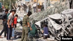 This file photo shows a Red Crescent ambulance destroyed by what activists say was a barrel bomb in Syria. Fifty Red Crescent volunteers have now lost their lives since the beginning of the conflict in Syria.