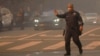 A police officer directs traffic so people can evacuate as a wildfire breaks out near Pacific Palisades on the west side of Los Angeles on Jan. 7, 2025. The World Meteorological Organization says evacuation plans are important in saving lives in natural disasters.