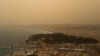 FILE—This photograph taken on March 30, 2024, shows thick sand dust blown in from the Sahara giving the sky a yellowish appearance above the French riviera city of Nice, southern France.