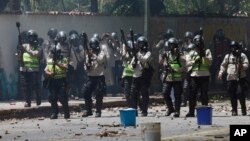 National Police stand ready to launch tear gas at student protesters outside the Central University of Venezuela in Caracas, May 4, 2017. 