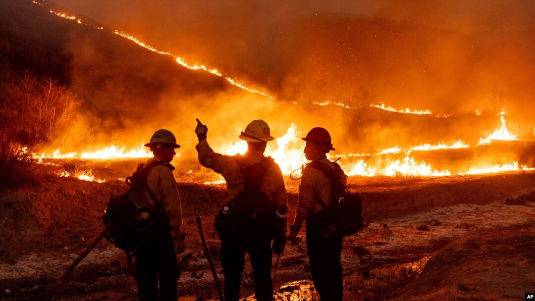 Fire crews battle the Kenneth Fire in the West Hills section of Los Angeles, Jan. 9, 2025. (