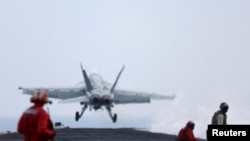 FILE - A F/A-18E Super Hornet fighter jet is catapulted off the flight deck of the USS Dwight D. Eisenhower (CVN 69) aircraft carrier in Southern Red Sea, Middle East, Feb. 13, 2024. 