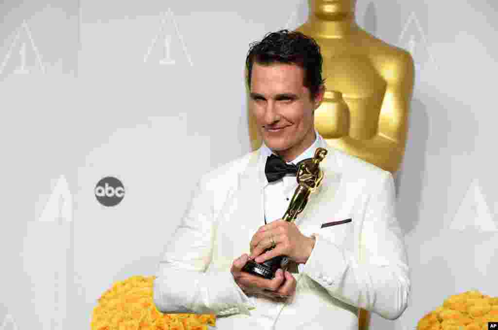 Matthew McConaughey winner of the award for best actor for his role in the "Dallas Buyers Club" poses in the press room during the Oscars.