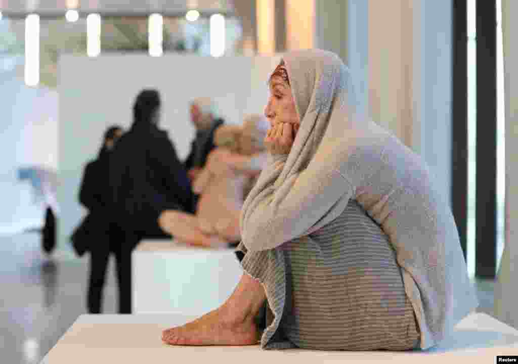 A hyperrealist artwork called "Cornered" by Marc Sijan is seen at the hyperrealism sculptures exhibition "Ceci n'est pas un corps" in Liege, Belgium, Nov. 20, 2019.