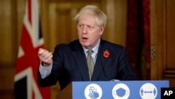 Britain's Prime Minister Boris Johnson speaks during a virtual press conference on the coronavirus pandemic at 10 Downing Street in London, Nov. 9, 2020. 