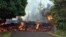 Photo provided by the U.S. Geological Survey shows a lava flow moving across Makamae Street in the Leilani Estates subdivision near Pahoa on the island of Hawaii, May 6, 2018.