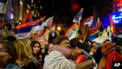 Broad Front party supporters look dejected as they listen to the elections results in Montevideo, Uruguay, Sunday, Nov. 24, 2019.