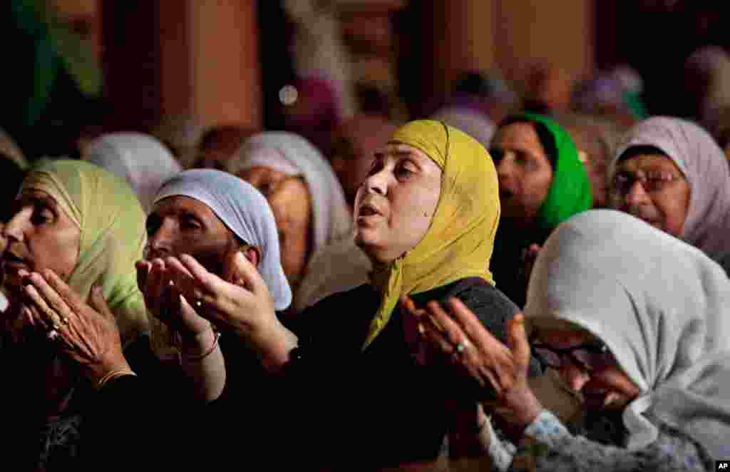 Kashmiri Muslim women pray inside the Jamia Masjid or grand mosque in Srinagar, India.