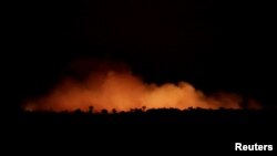 Smoke billows during a fire in an area of the Amazon rainforest near Humaita, Amazonas State, Brazil, Brazil August 17, 2019. Picture Taken August 17, 2019. REUTERS/Ueslei Marcelino