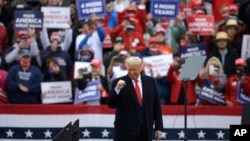 President Donald Trump gestures at the conclusion of a campaign rally at Lancaster Airport, in Lititz, Pennsylvania, Oct. 26, 2020. 